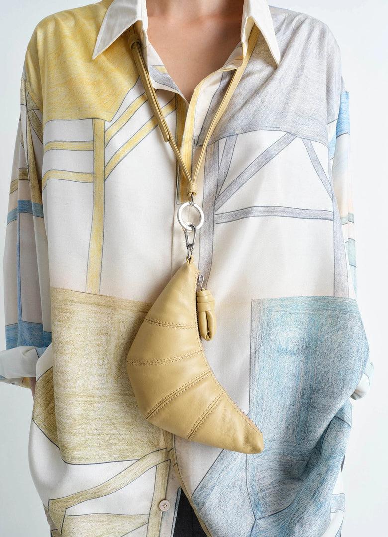 Christophe Lemaire PORTE-MONNAIE CROISSANT BANDOULIÈRE