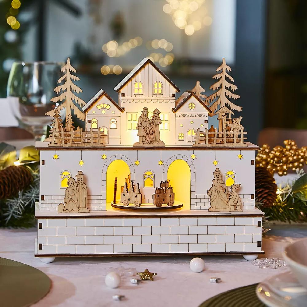 eminza Village de Noël en bois lumineux et musical à piles (21 x H24 cm) Villageois en fête
