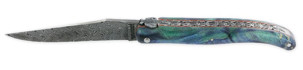 Laguiole Couteau Laguiole En Aubrac Prestige 1 Pièce 12 Cm Double Platines Et Ressort Guillochés Manche En Loupe De Sureau Vert Et Bleu Finition Brossée Mouche Prestige Lame Damas PIECE UNIQUE