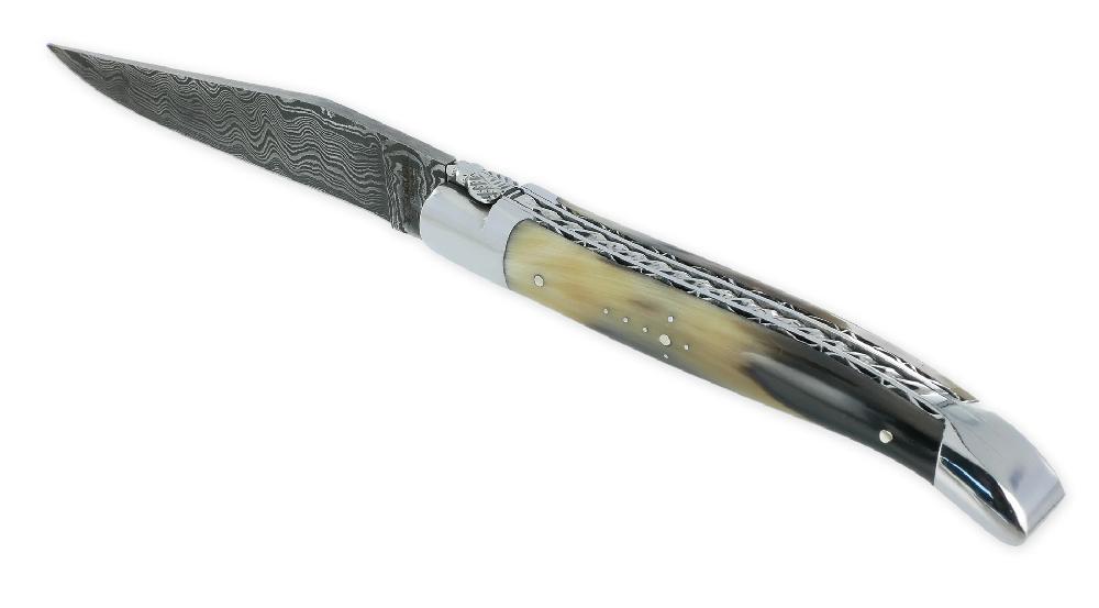 laguiole Laguiole en Aubrac knife 1 piece 12cm 2 Shiny stainless steel bolsters Spirale spring Flamed horn tip handle Double hand-carved plates Laminated Damascus blade N°2