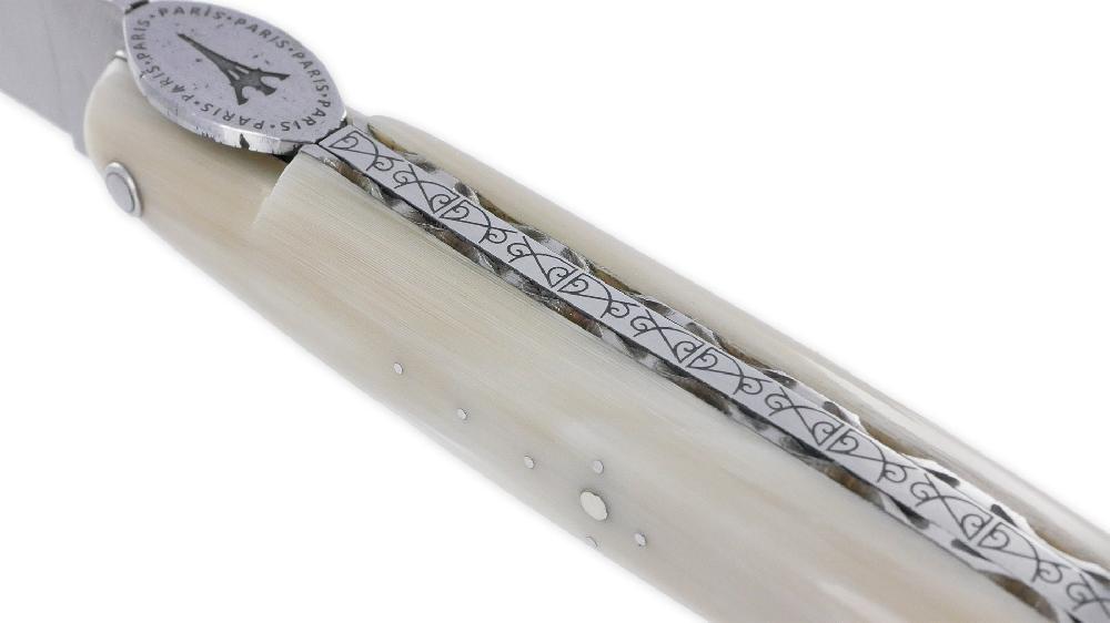 Laguiole Laguiole En Aubrac Knife 1 Piece 12cm Eiffel Tower Full Handle Horn Tip Brushed Stainless Steel Plates Guilloché Engraved Spring Flat Fly In The Shape Of A Medallion With The Eiffel Tower In The Center Brushed Finish L
