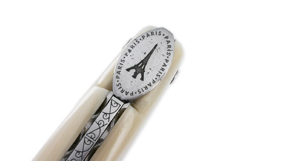 Laguiole Laguiole En Aubrac Knife 1 Piece 12cm Eiffel Tower Full Handle Horn Tip Brushed Stainless Steel Plates Guilloché Engraved Spring Flat Fly In The Shape Of A Medallion With The Eiffel Tower In The Center Brushed Finish L