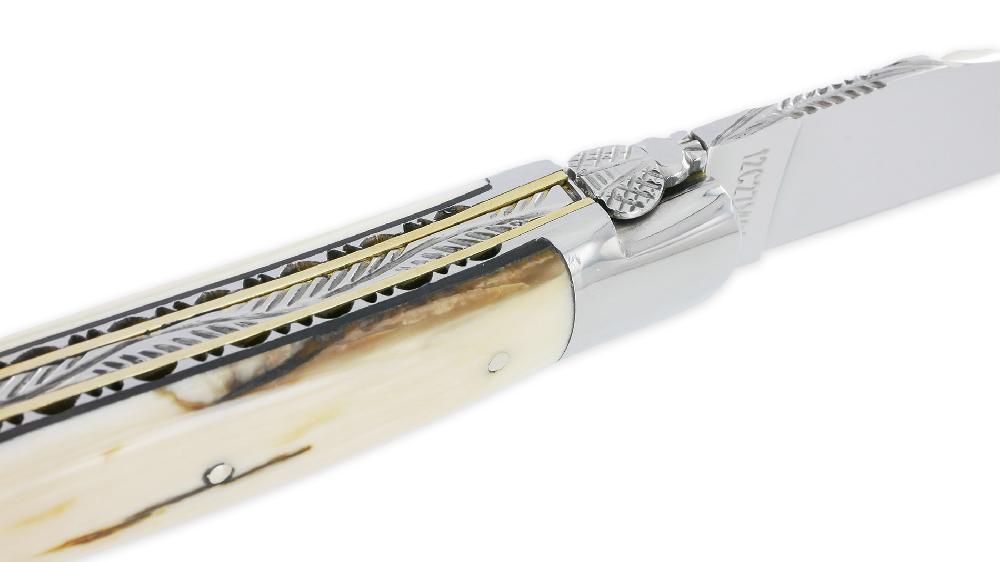 Laguiole Laguiole En Aubrac Knife 1 Piece 12cm Mammoth Ivory Crust Handle 2 Double Bolsters Bright Stainless Steel And Brass Carved Plates Black Spacer Handcarved Spring Shiny Finish